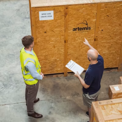 Artemis Aerospace warehouse workers locating aircraft parts for clients.
